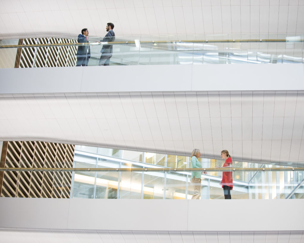 Business people meeting in modern office on different floors