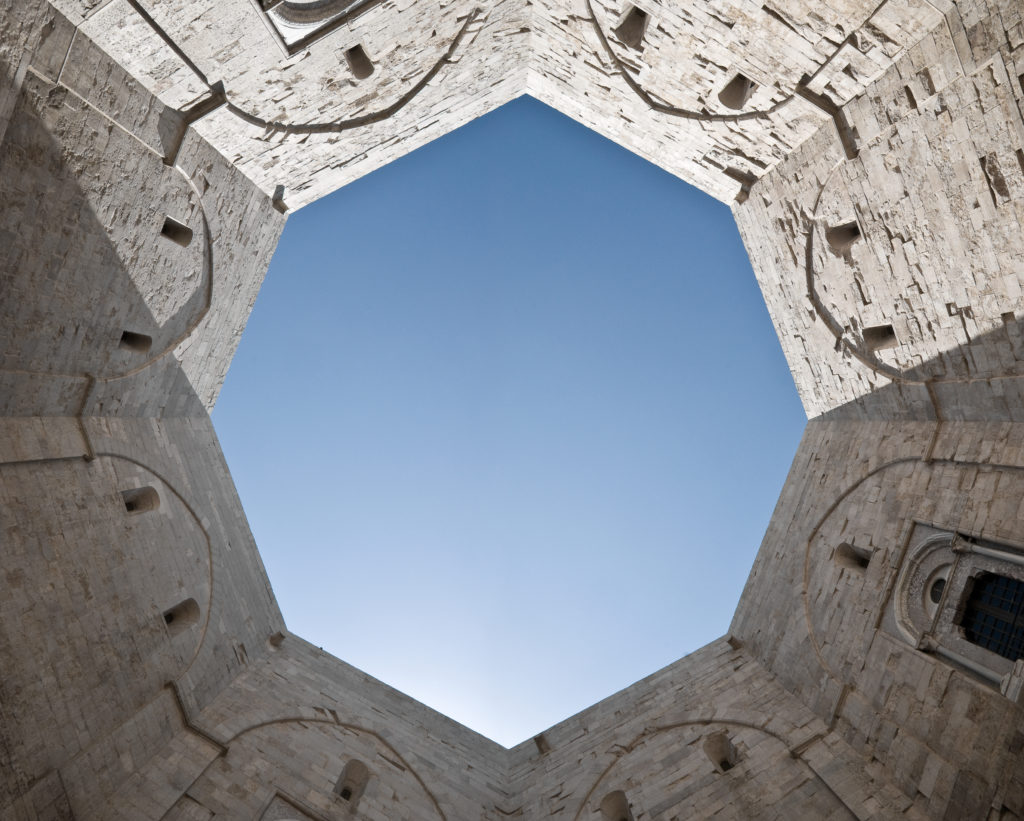 Octagon courtyard - view from below looking up at the blue sky